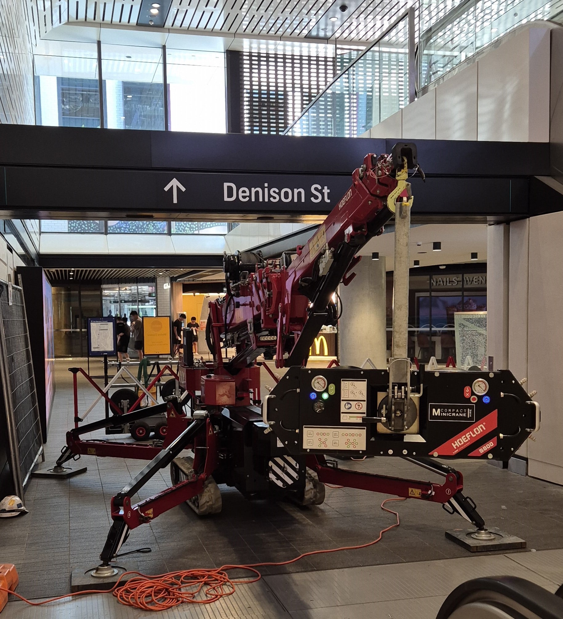 Replacing glass at a sydney metro station using the hoeflon c6 crane & s800 glass lifter. Running on electric to eliminate fumes and emissions.